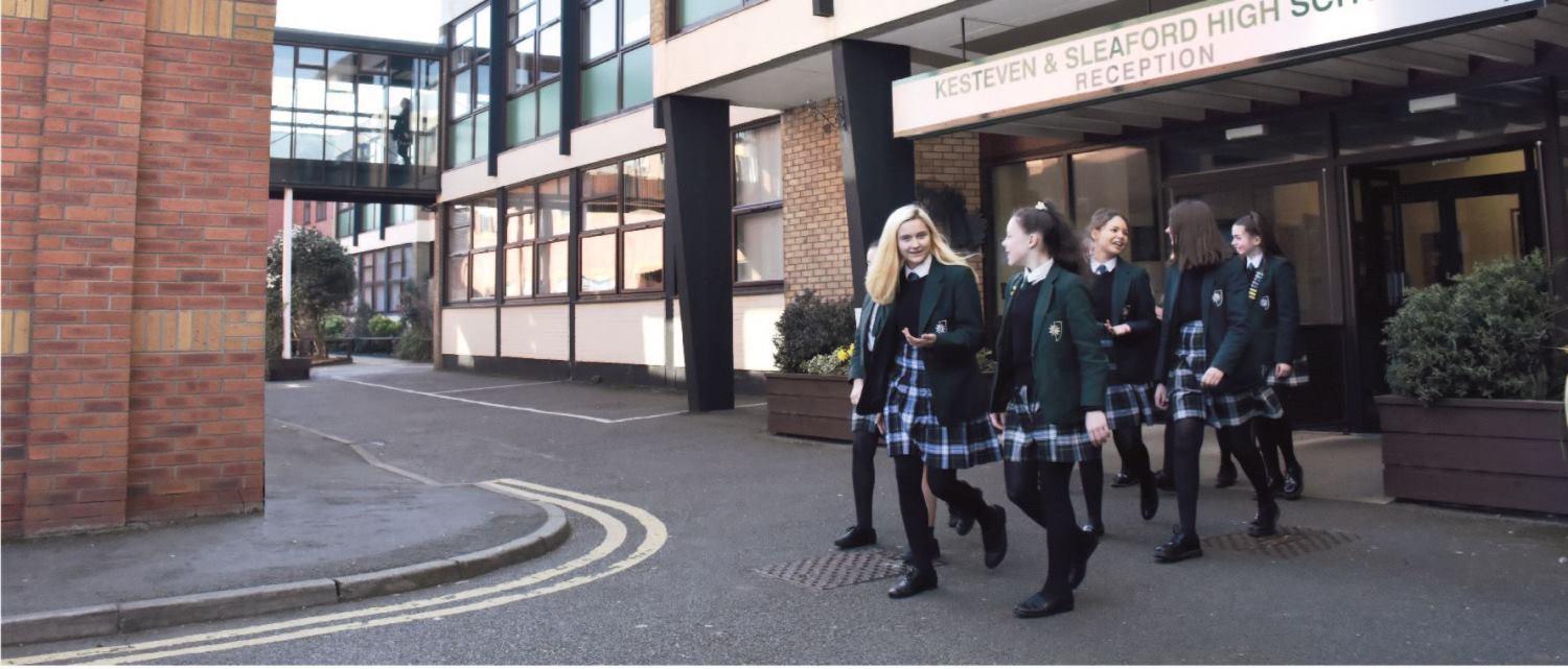 A group of students walking out of the school's main reception