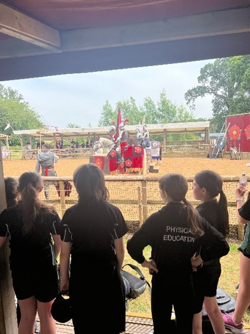 students watching jousting