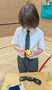 student with colourful blocks