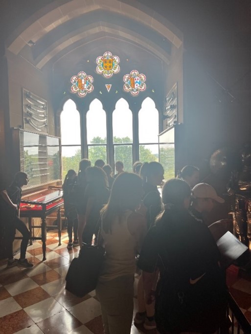 students looking through stained glass windows