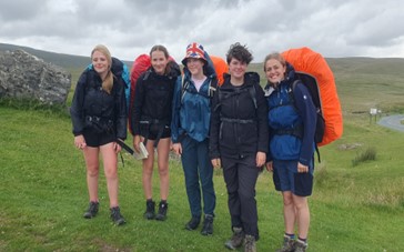group of students in the rain
