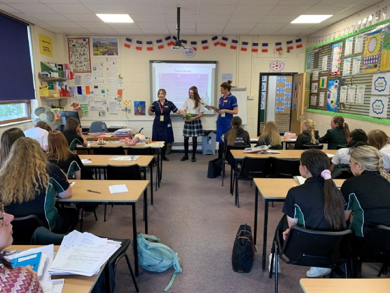 students with midwives in a classroom