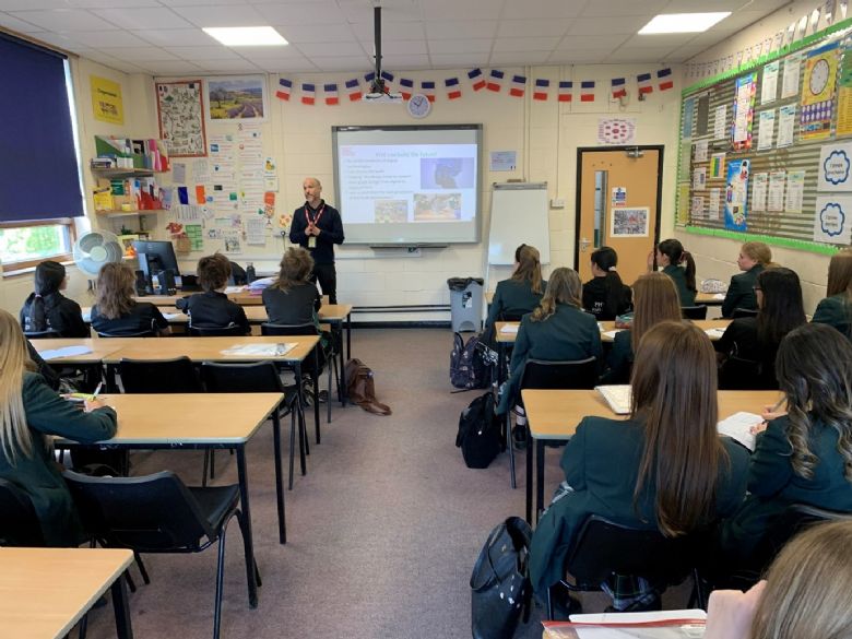 a quantity surveyor describing his job to a class of students