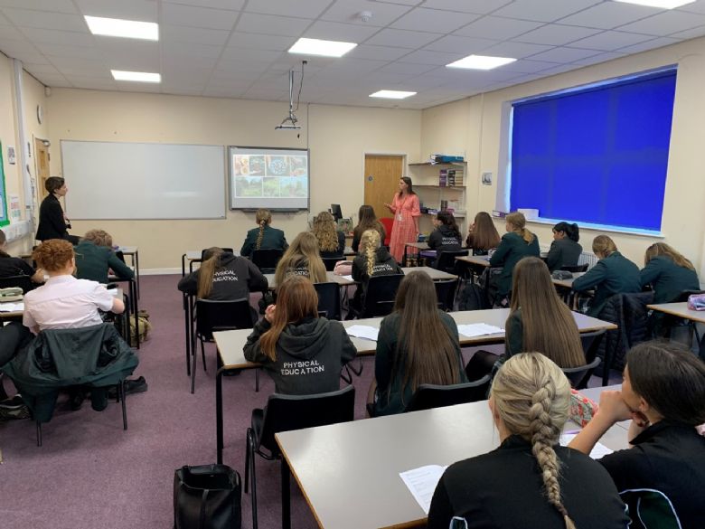 students listening to a catering company describing their job