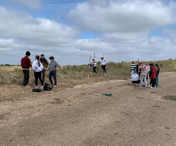 students in sand dunes