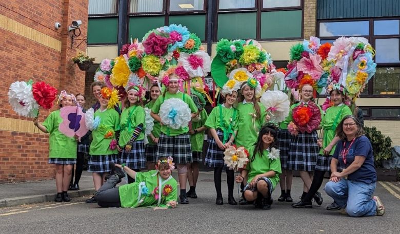 group of students with paper flowers