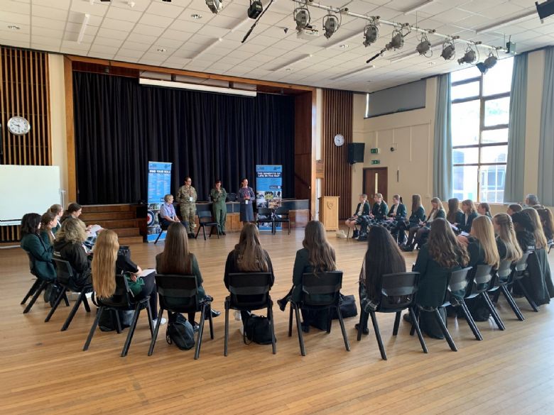 students in a hall being told about the RAF