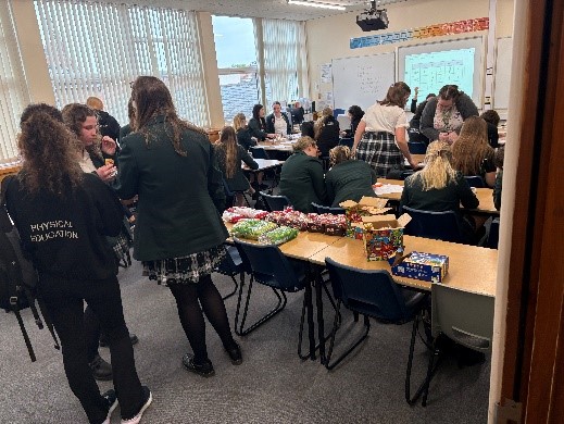 students discussing maths and eating breakfast