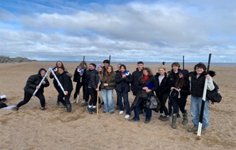 large group of students on beach