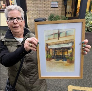 member of staff with picture