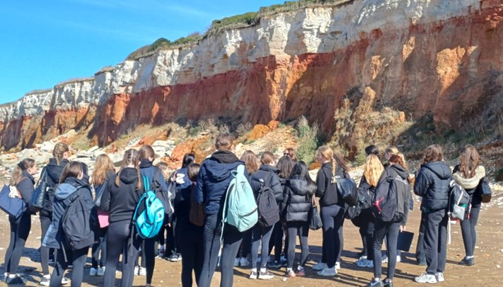 group of students near cliffs