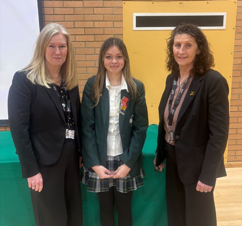 Year 10 student collecting awards