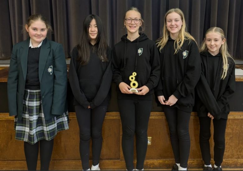 Year 7 STEM students with trophy won for their design