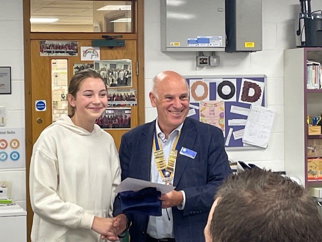 second placed student receiving certificate